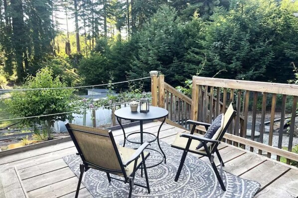 Relax on the private patio overlooking the redwoods.
