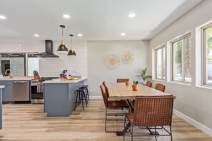 Formal dining area offering a table set for 6 guests.