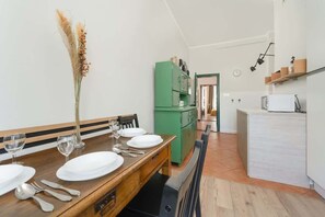 Independent kitchen with dining area.