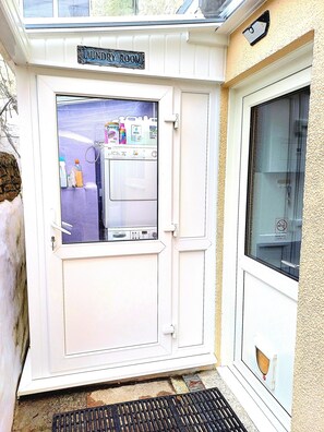 Laundry room and apartment entrance 