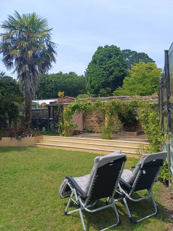 Garden terrace with zero gravity sun loungers 