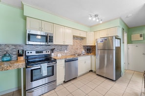 This adorable unit offers guests a full kitchen with stainless-steel appliances and everything you need to prepare meals for family and friends.