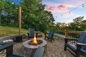 Relax by the cozy fire pit under the stars, surrounded by nature.