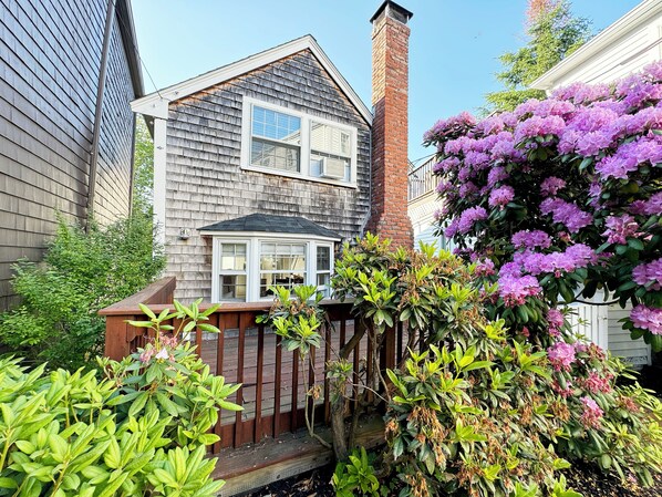 Exterior view of front deck and cottage.