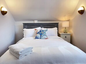 Queen bedroom with window AC.