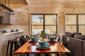 Gather around the rustic dining table for memorable meals and cozy conversations.