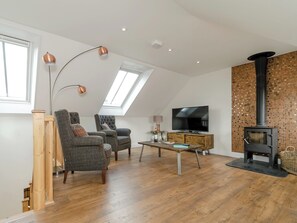 Delightful living room with wood burner | The Forge - The Forge and Seaview Cottage, Grinkle, near Staithes