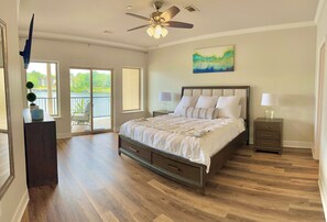 The spacious master bedroom has private access to the balcony.