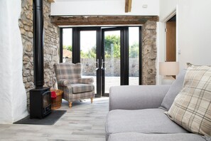 Patio doors leading from the living room to the garden