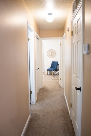This corridor sets the stage to the 2 bedrooms for your relaxation. 