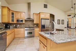 Fully stocked chef's kitchen with 6 burner gas range