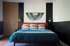Unwind in the luxurious master suite king-size bed with premium plush linens.
