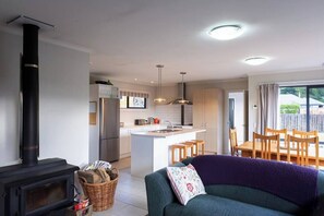 Lovely open kitchen, dining, and living rooms.  Wood burning fireplace and central heating to keep everywhere warm and cozy in the winter.  