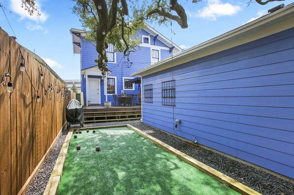 Bocce Ball court in the backyard! This is at the end of the court looking onto the back deck area.  Court is between the garage and private fence.