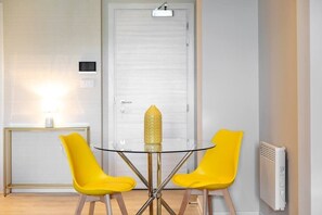 Integrated living, bedroom, and kitchen spaces in an open layout.