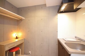A kitchenette is located at the back of the bedroom to support your comfortable stay.