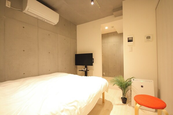 There is a double bed just inside the entrance.