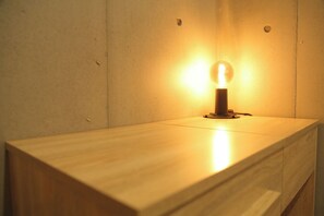  A storage rack is provided above the multi-purpose desk.