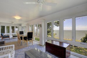 The sunporch on the 2nd floor, originally a wrap-around porch, overlooks the Bay.