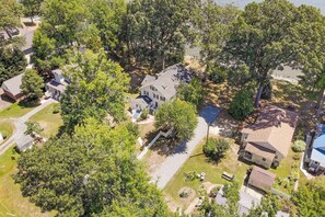 Aerial view of the waterfront home and expansive property.