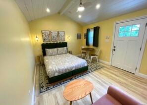 Queen bed with artwork inspired by your cottage garden just outside the door.