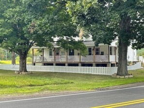 Pet and family friendly front porch with iconic white picket fence.