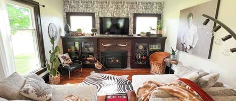 Enjoy a cozy fire and your favorite movie in our western themed living room...