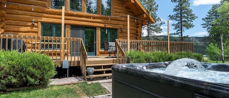 The hot tub features a stunning design that seamlessly blends with the patio's aesthetic.