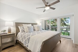 Unwind in the Master Bedroom Suite with Private Balcony, Gorgeous Golf Course and Lakeside Views, and a Flat Screen Smart TV (King Bed)