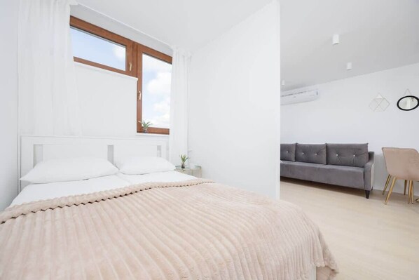 Living area with double bed.