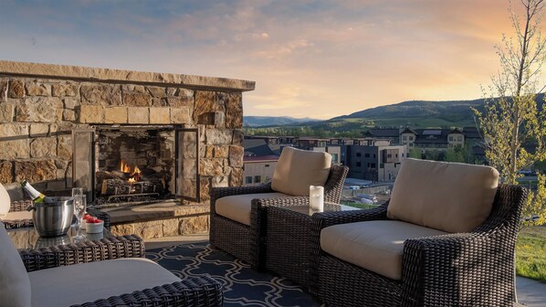 Enjoy the views from this cozy outdoor fieplace