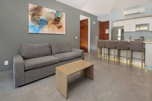 Unwind in central AC on cozy furniture whenever you're not down by the sparkling pool.
