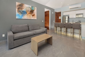 Unwind in central AC on cozy furniture whenever you're not down by the sparkling pool.