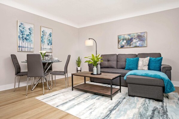 The living room has a comfortable sofa bed