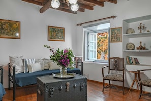 A relaxing area with comfortable seating and expansive windows framing stunning views