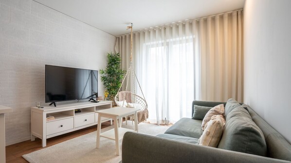 Relax and unwind in our spacious living room, perfect for gatherings or quiet evenings. #CozyComfort #HomeAwayFromHome