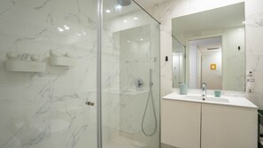 Pamper yourself in our luxurious bathroom oasis, featuring a rejuvenating shower. #SpaRetreat #RefreshRenew
