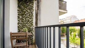 Savor breathtaking views and fresh air from our private balcony, an ideal spot for relaxation. #ScenicEscape #OutdoorBliss