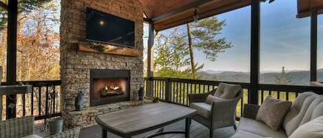 Enjoy the mountain view while relaxing on the comfy outdoor furniture surrounding the wood-burning fireplace on the main level deck. Catch up on your favorite teams with the steaming TV.