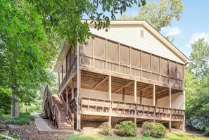 Two story entertaining deck overlooking the lake. The top level is screened in.