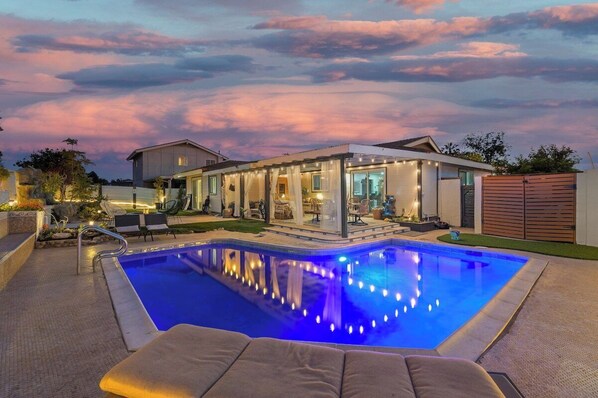 Soak up the San Diego sun poolside or enjoy a moonlight dip in our warm, heated pool. Backyard also includes a jacuzzi, sauna, fire pit, waterfall and tons of fun games to play like golf, corn hole, outdoor jenga and more!