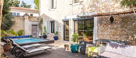 Daytime, Building, Plant, Furniture, Window, Green, Table, Outdoor Furniture, Sunlight, Yellow