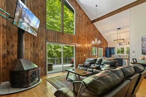 Reclining Sofas, Gas Fireplace, TV, and Access to the Back Deck