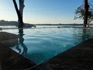 Infinity pool looking onto lake.