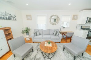 A modernly decorated living room offers exceptional comfort, 