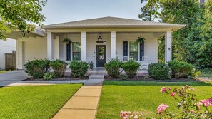 Charming coastal bungalow with a welcoming front porch, perfect for relaxing with morning coffee or evening cocktails.