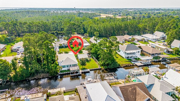Idyllic canal-side home offering serene water views and easy access to Gulf Breeze's beautiful waterways.