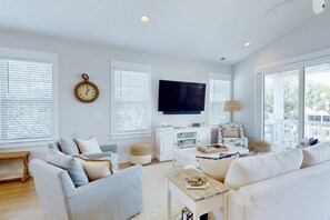Watch the big game, read a book or chat in this lovely living room