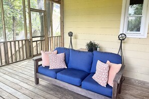 Screened in backyard porch if off of the second bedroom. Great to sit outside and have your morning coffee.