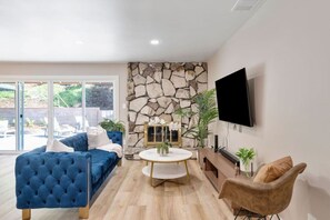 Sit back, relax, and enjoy your favorite shows in our cozy living room with a big-screen TV!